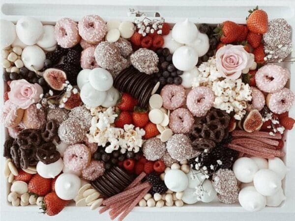 A beautiful arrangement of assorted chocolates, donuts, and sweets.