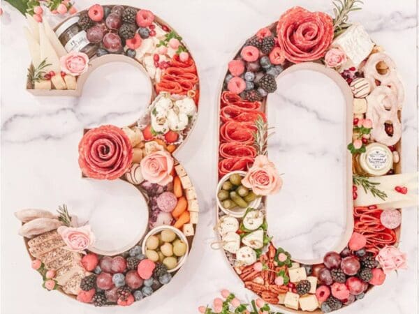 Decorative floral arrangement forming the number 30.