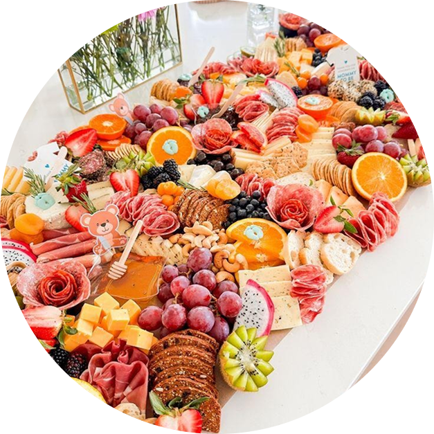 Elegant charcuterie board with fruits, cheeses, and meats.